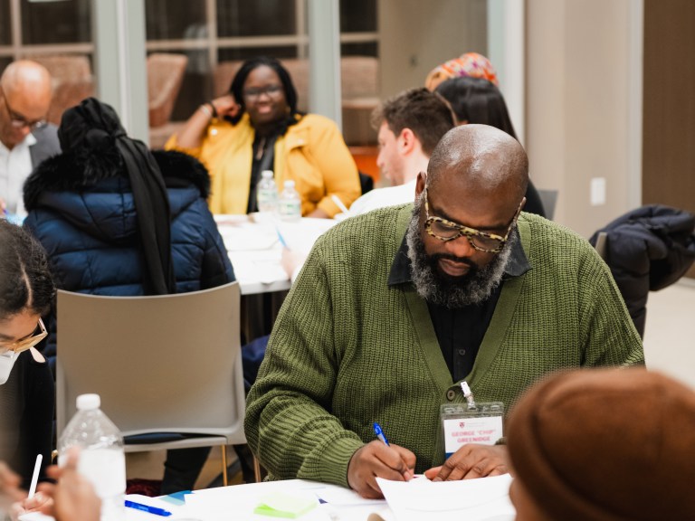 A person writing down notes