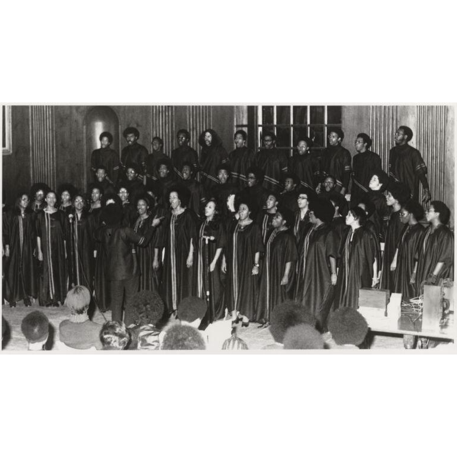 A choir of Black students singing