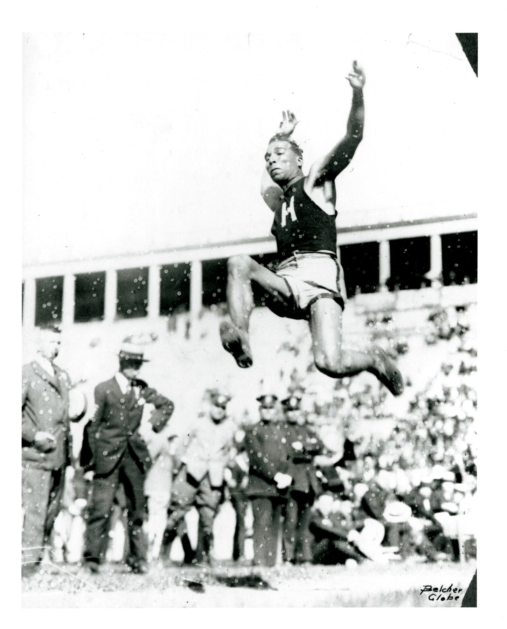 Edward “Ned” Gourdin doing the long jump